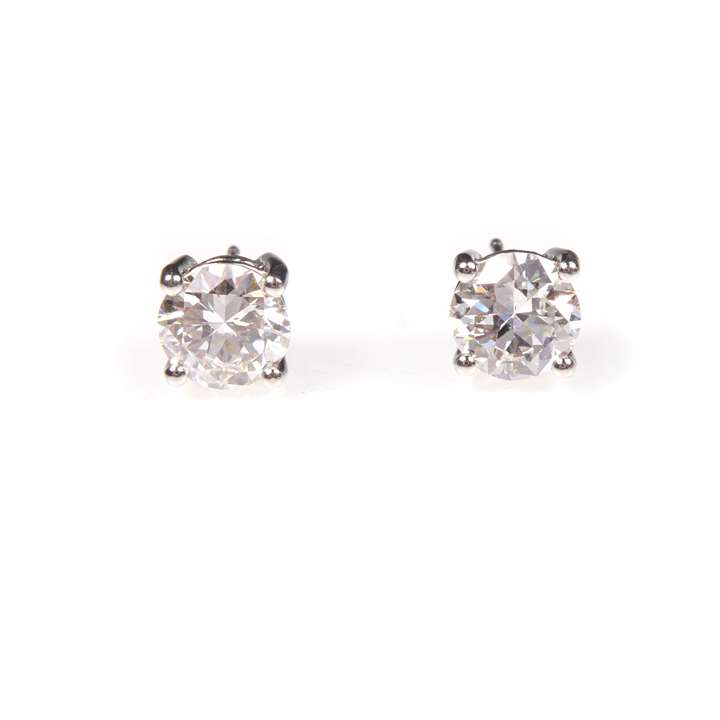 Pair of round brilliant cut diamond stud earrings